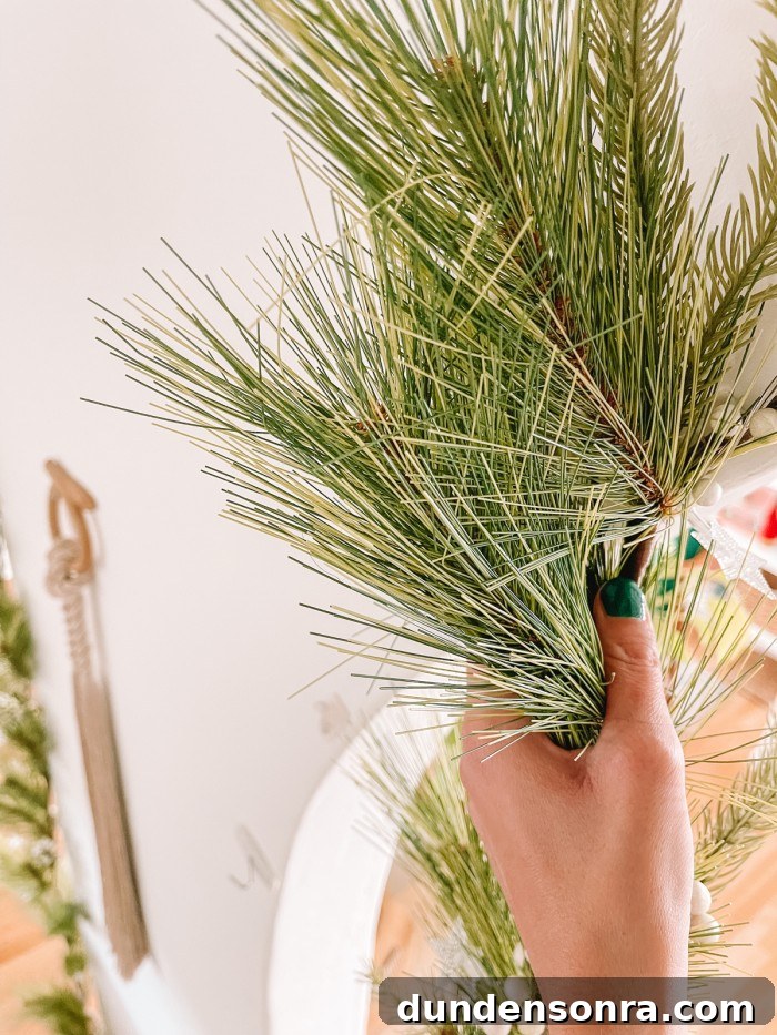 Creative Ways to Display Christmas Cards This Holiday Season 8 holding garland on wall