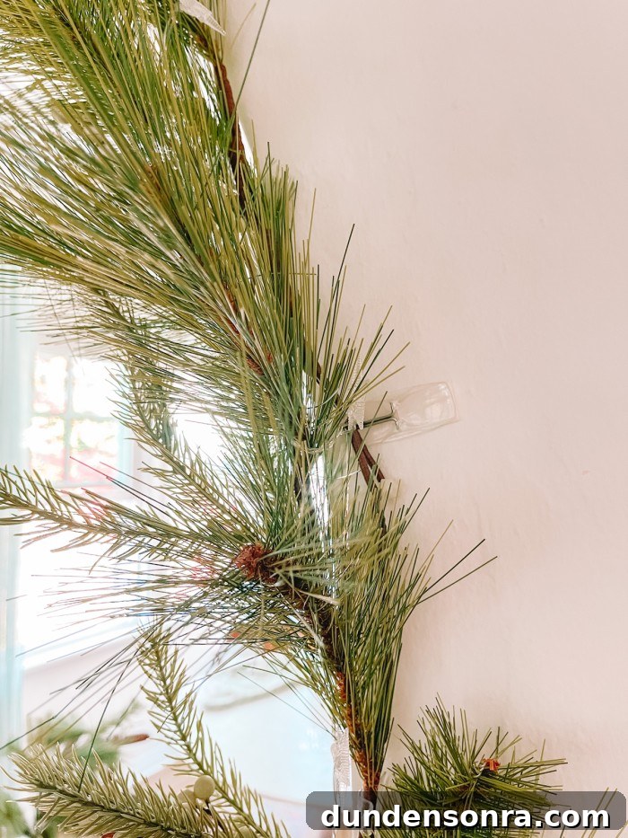 Creative Ways to Display Christmas Cards This Holiday Season 9 garland on arch