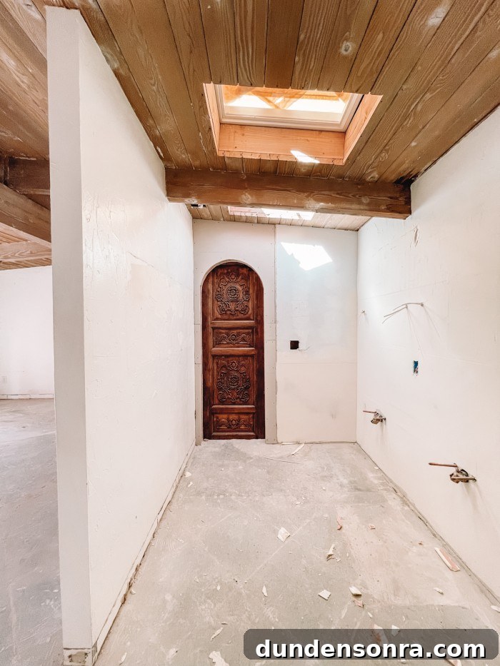 Palm Springs Main Bathroom Remodel Ideas and Plans 4 Archway with antique door in bathroom