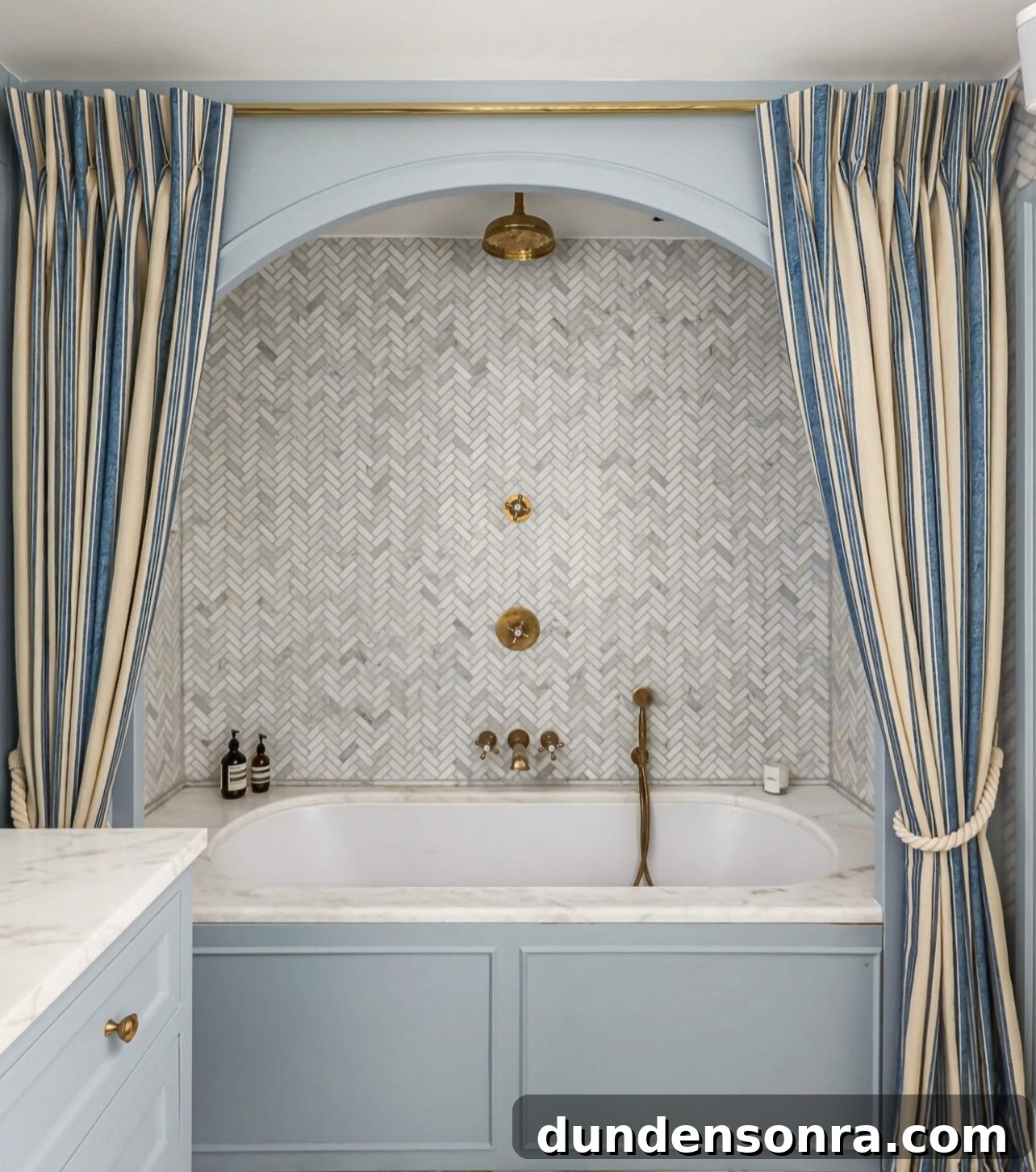 striped shower curtain above bathroom