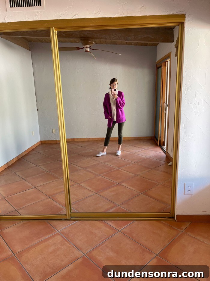 girl standing in front of mirrored closet doors