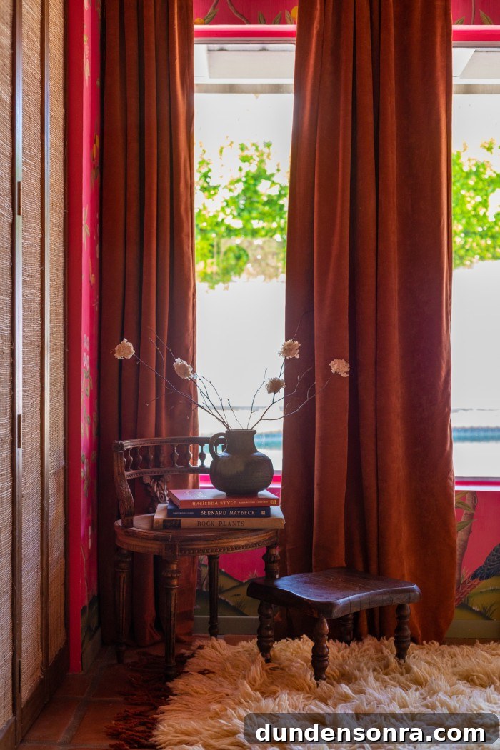 velvet curtains with wood chair in front stacked with books