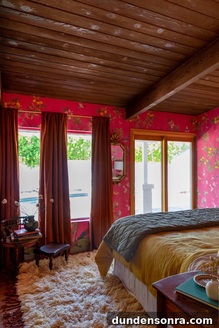 pink bedroom with curtains and bed in front