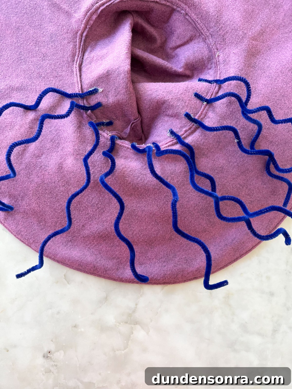 purple witch hat with pipe cleaner hair