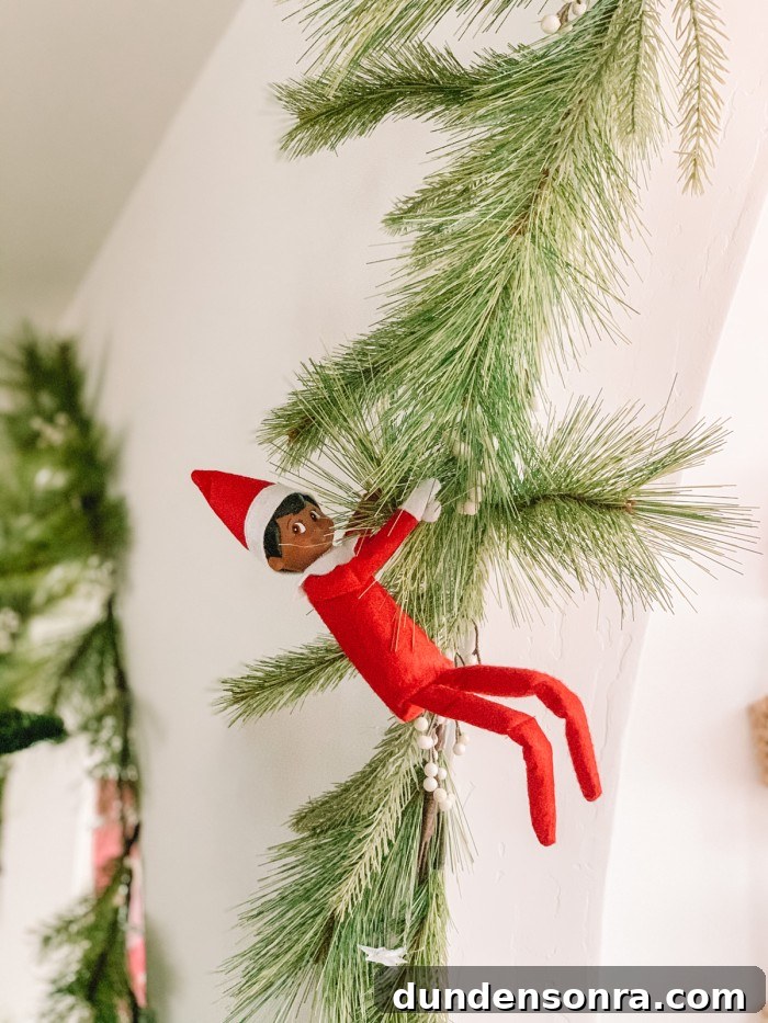 elf hanging from garland