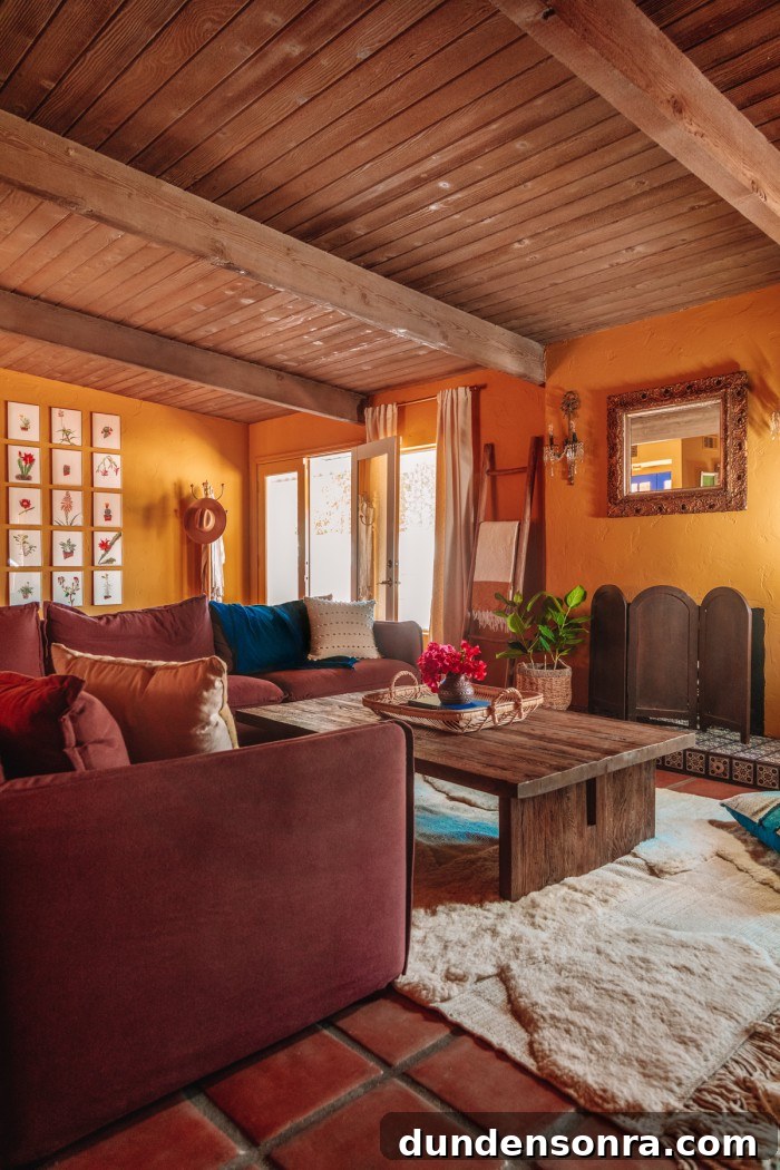 plum sofa in ochre living room