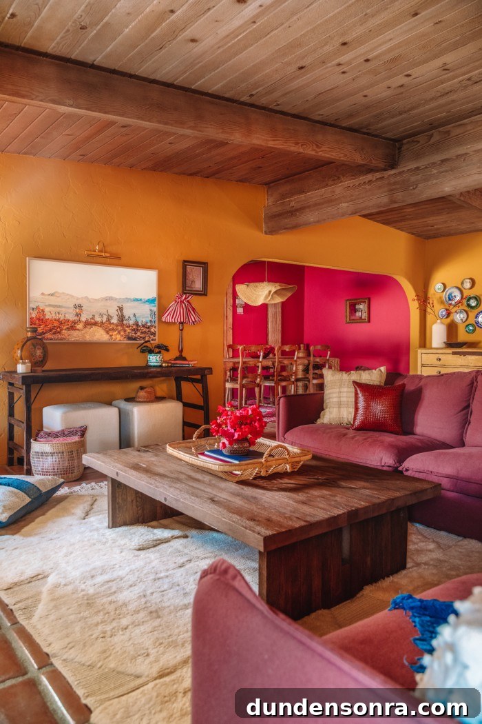 Purple couch and wood coffee table in ochre living room