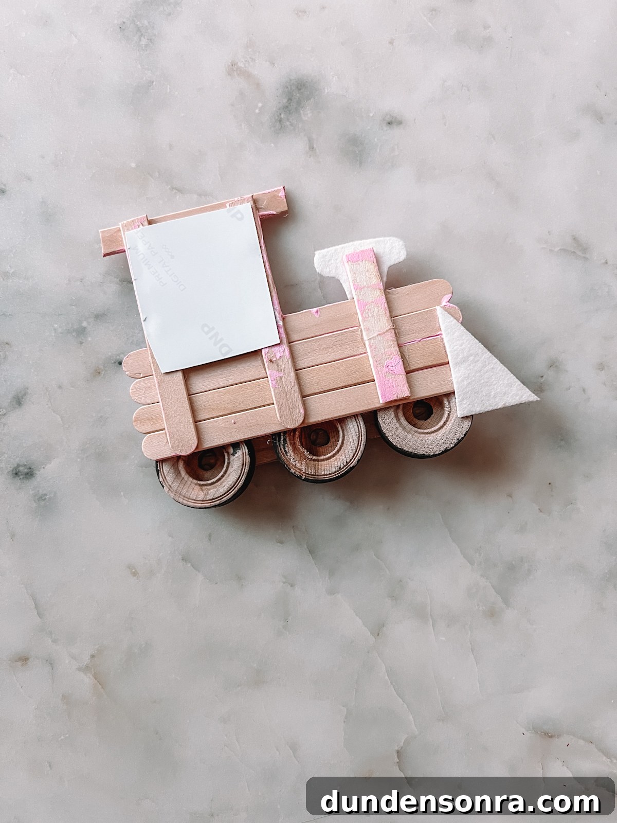 popsicle stick train upside down on table