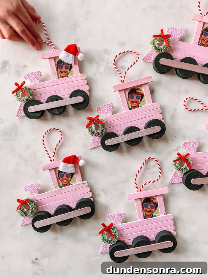 Popsicle Stick Train Christmas Ornaments on marble table