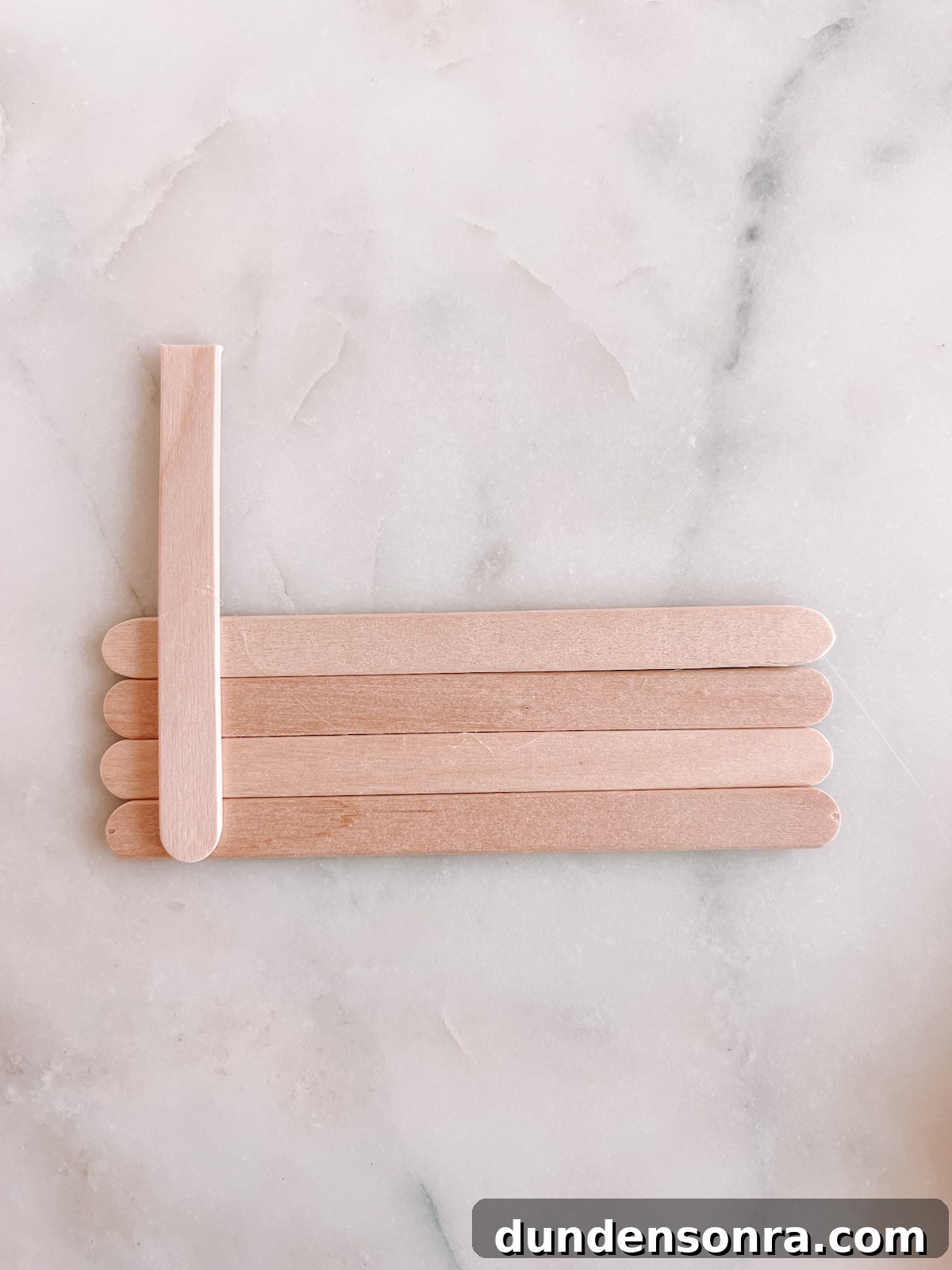 popsicle sticks on marble table