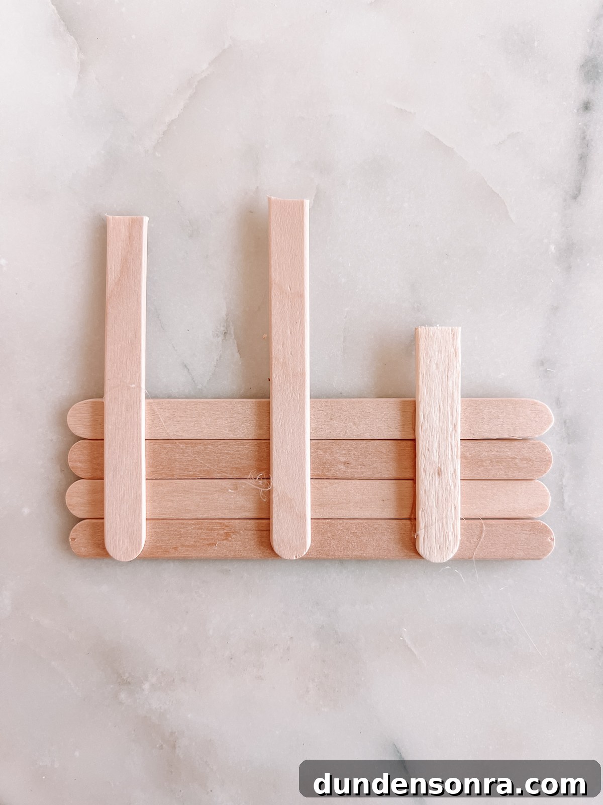 popsicle sticks on marble
