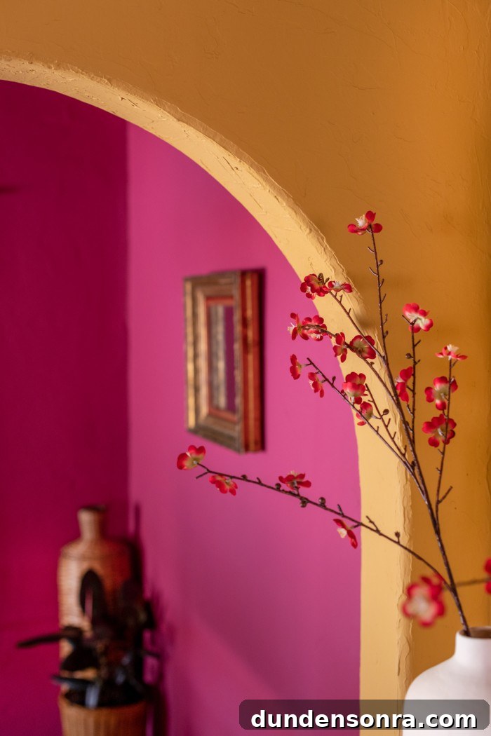 Magenta Pink Dining Room Ideas: Bold Color Decor Inspiration 7 yellow arch with pink room behind it and red flowers