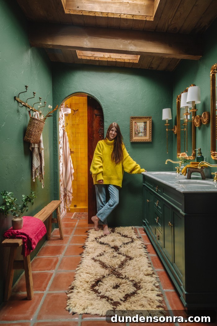 woman standing in green bathroom