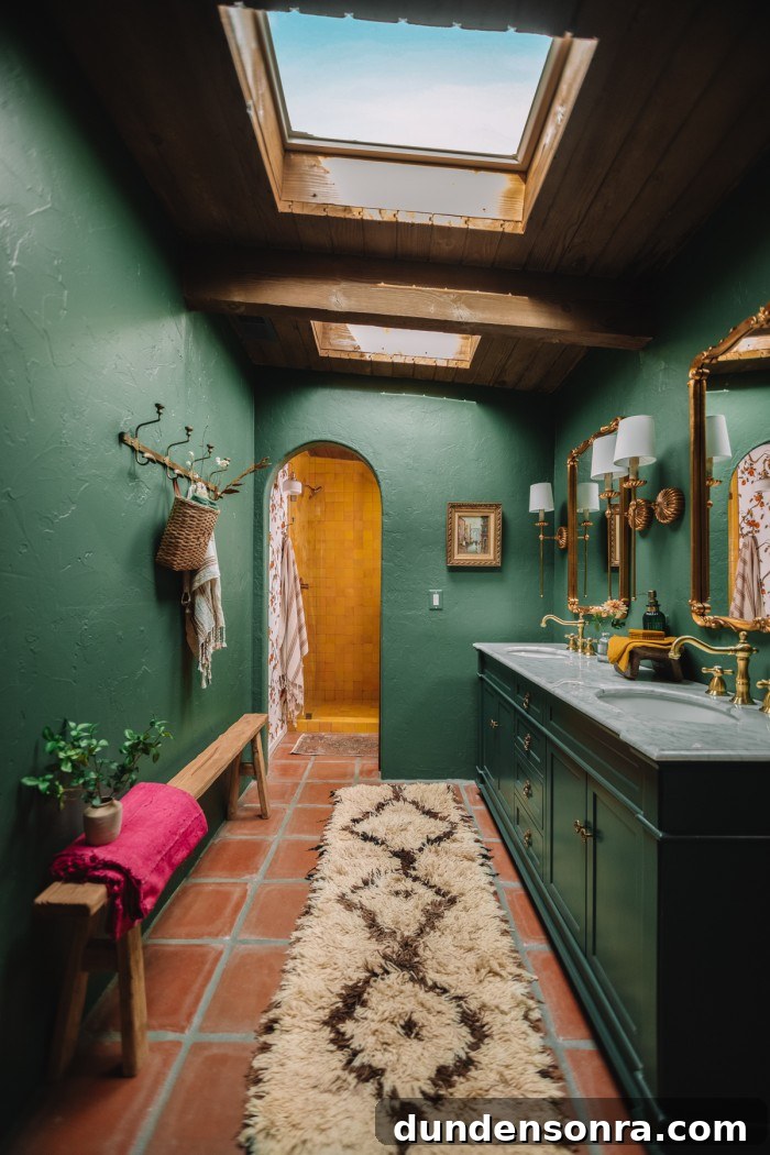 dark green bathroom with skylights and archway to yellow shower