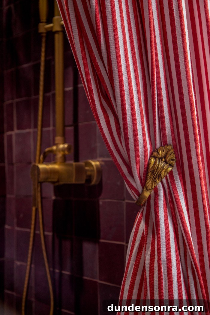 Rich, Moody Purple Bathroom Design Ideas 17 Red striped shower curtain with gold swan neck curtain tie back