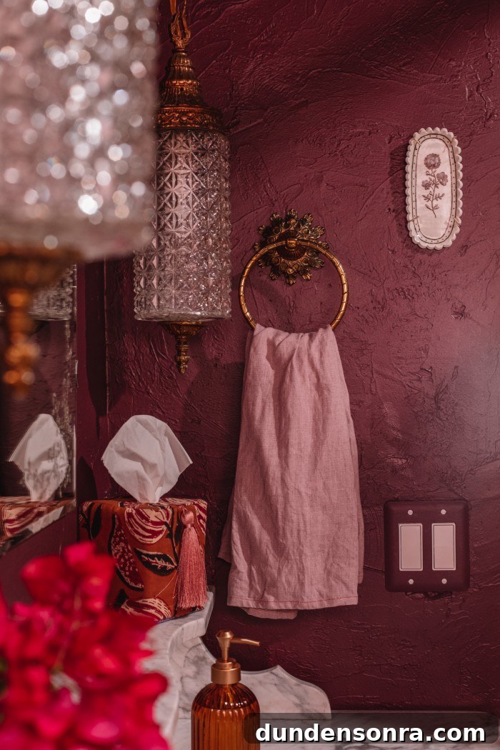 Rich, Moody Purple Bathroom Design Ideas 3 Purple bathroom with gold towel hook and purple towel