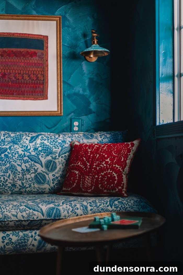 Textured Teal Bunk Room Ideas for Stylish Small Spaces 17 blue floral chair with red pillow in teal room