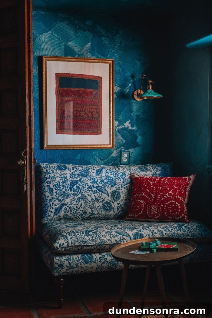 Textured Teal Bunk Room Ideas for Stylish Small Spaces 3 blue floral chair with red pillow in teal room