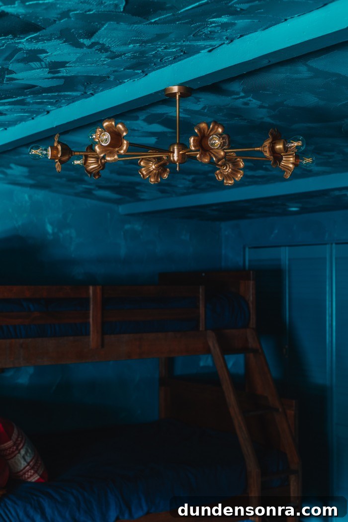 Textured Teal Bunk Room Ideas for Stylish Small Spaces 4 brass floral chandelier in teal room