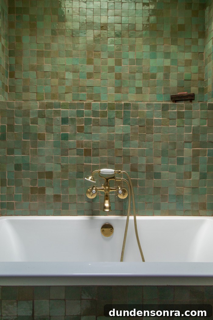 sage green tile above bathtub