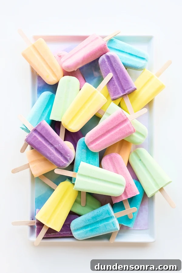 Popsicles stacked on a table.
