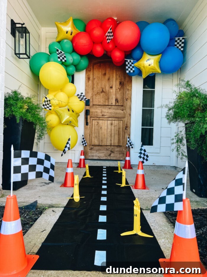 24 Super Mario Birthday Party Ideas to Wow Fans of All Ages 14 Mario balloon arc over front door.