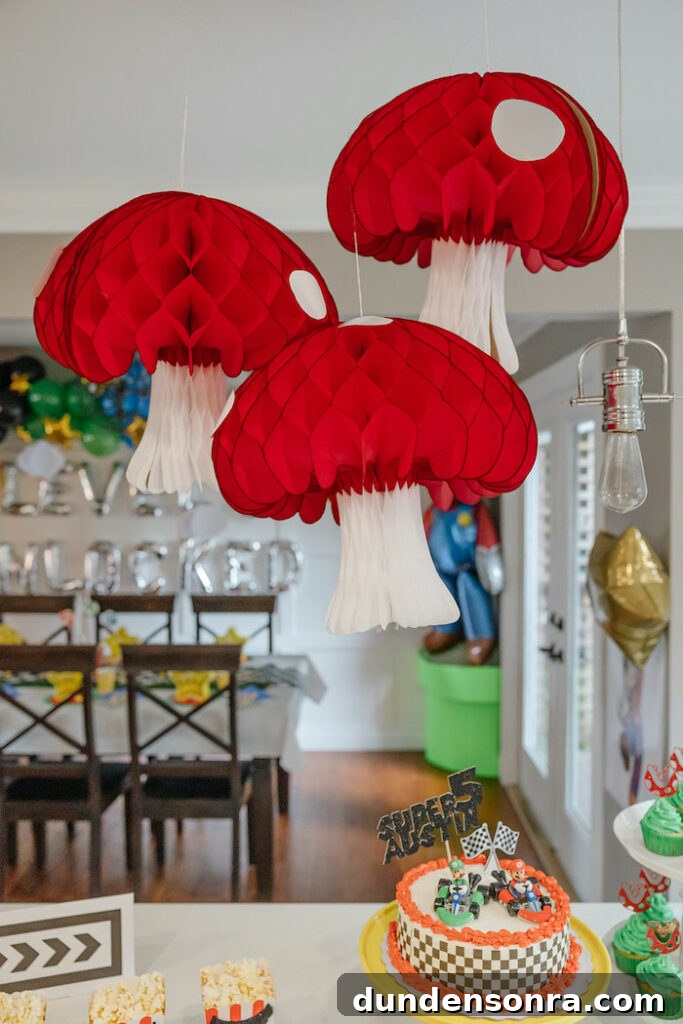 24 Super Mario Birthday Party Ideas to Wow Fans of All Ages 15 Toadstool mushrooms hanging decor.