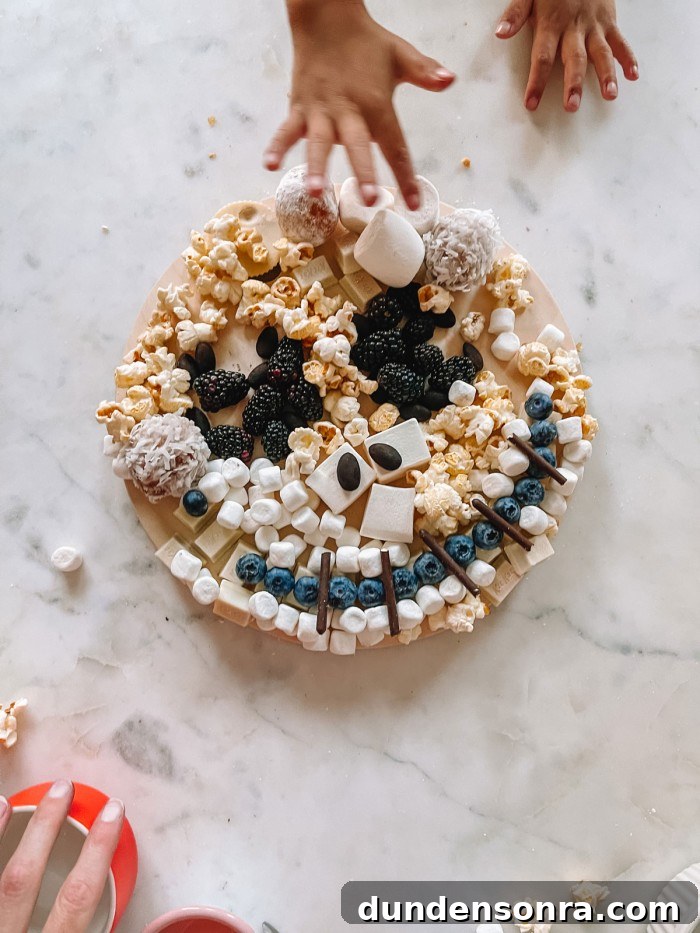 Jack Skellington Dessert Charcuterie Board Ideas for Parties 5 jack skellington dessert board with hand reaching in