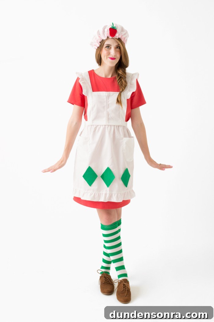 Singular strawberry shortcake with apron costume.