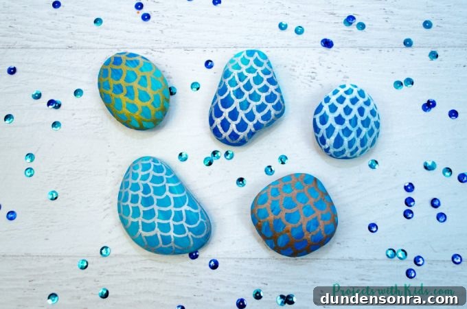 Mermaid Crafts for Kids: 25 Fun Underwater DIY Ideas 16 Painted rocks on a table.