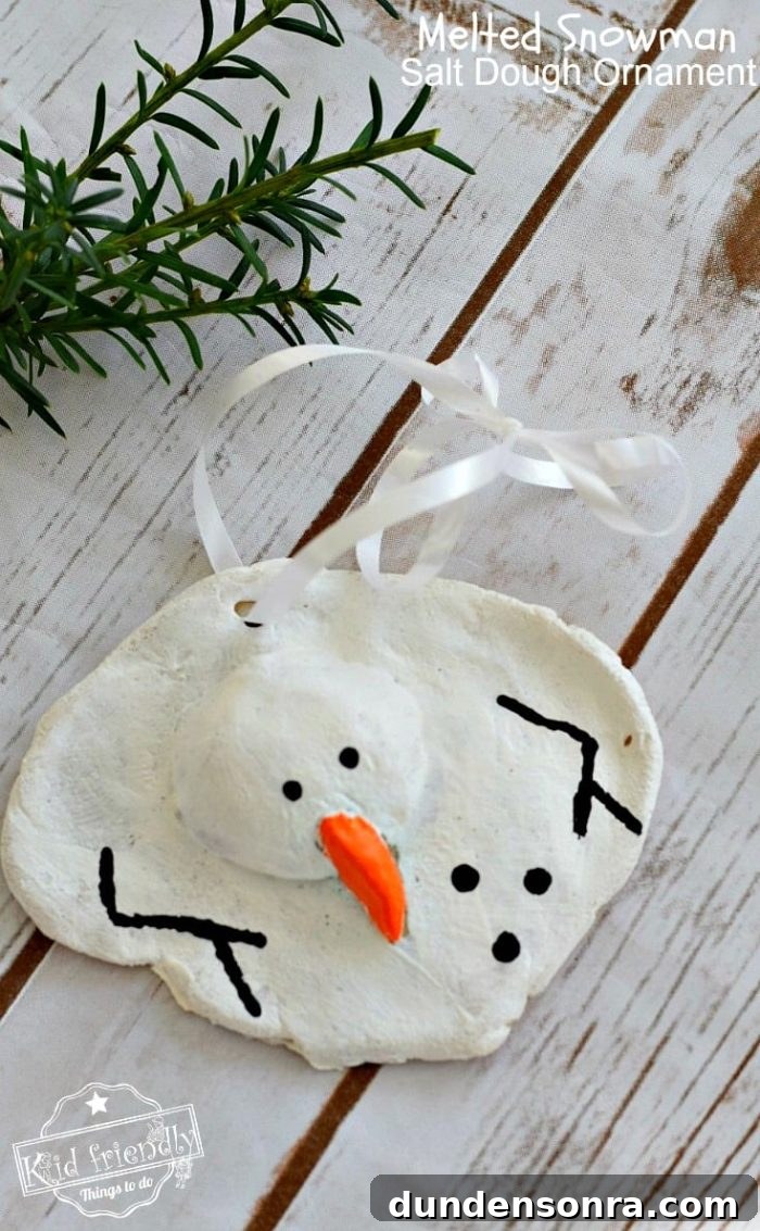 Handmade Christmas Ornaments Kids Can Make at Home 23 Melted snowman ornament on a white wood background.