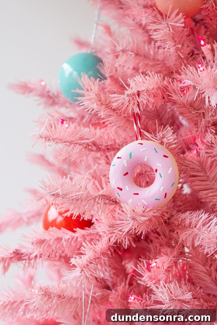 Handmade Christmas Ornaments Kids Can Make at Home 7 DIY Donut Ornament hanging on a pink tree.