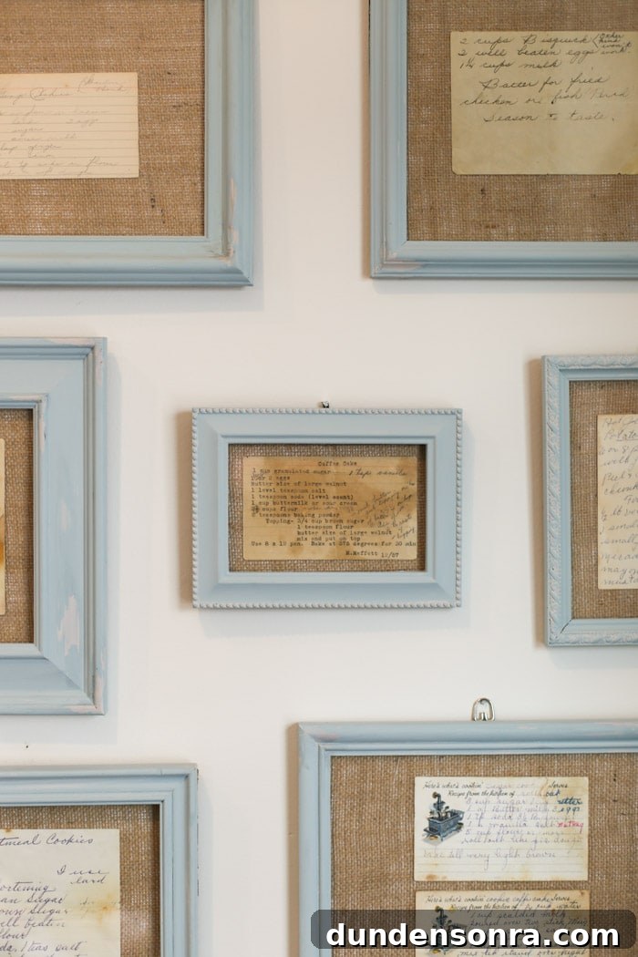 Handmade Gift Ideas Grandparents Will Cherish 16 Light blue frames hung on a wall with heirloom recipes in them.
