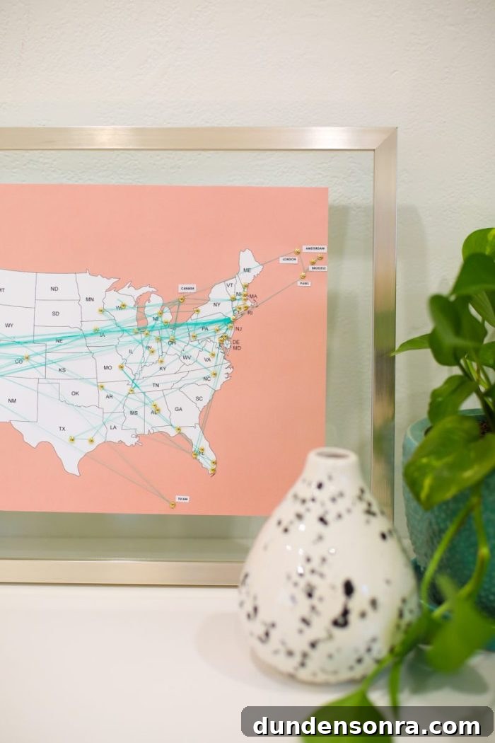 Handmade Gift Ideas Grandparents Will Cherish 7 Map of the USA in a frame with pins and yarn on it.