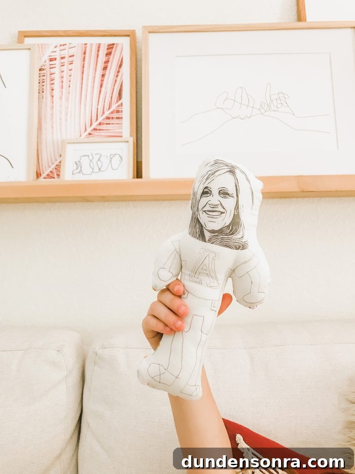 Handmade Gift Ideas Grandparents Will Cherish 10 Hand holding a plush homemade doll up in the air.