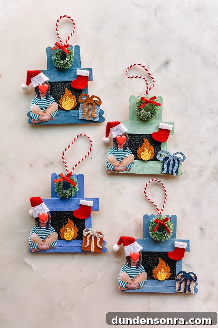 four popsicle stick fireplace ornaments on marble