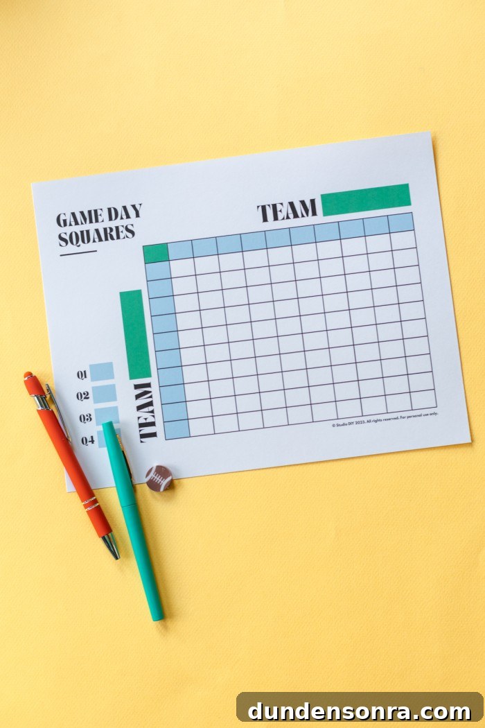 Paper with football game squares and pens next to it on a yellow background. 