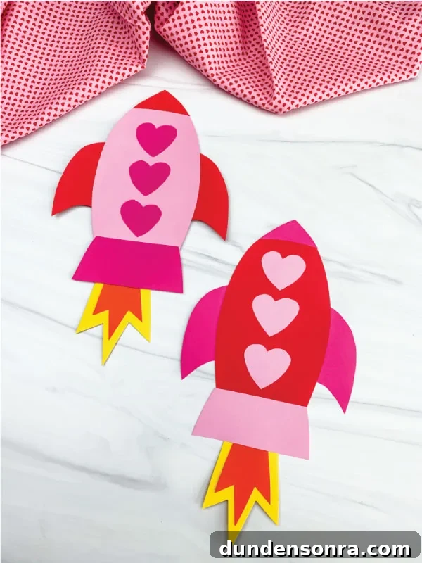 Two paper rockets with hearts as windows.