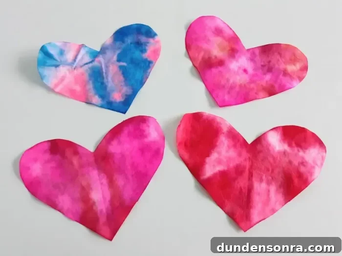 Coffee filter hearts with tie-dye designs.