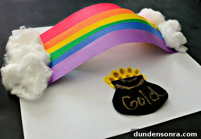 3D Rainbow Craft 3D rainbow made out of construction paper with a pot of gold underneath it.