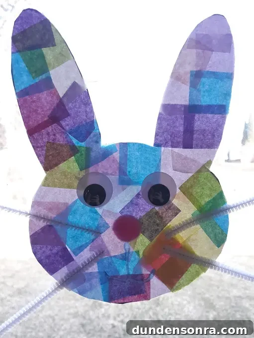Bunny made out of tissue paper and hung on a window. 