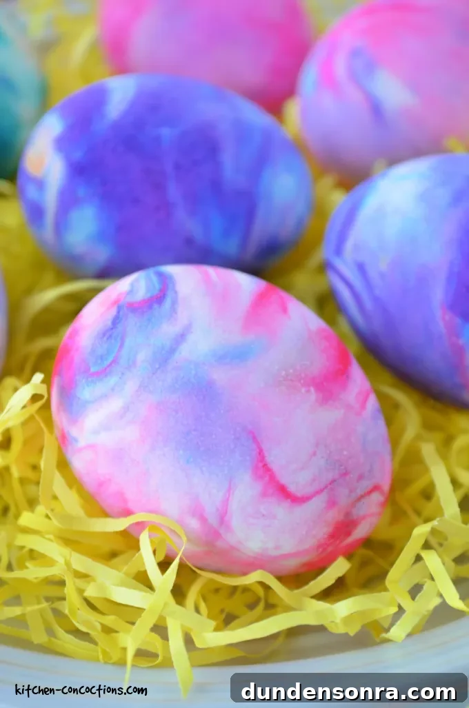 Tie dye easter eggs on yellow strips of paper. 