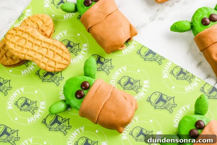 Yoda decorated cookies on a Star Wars background. 