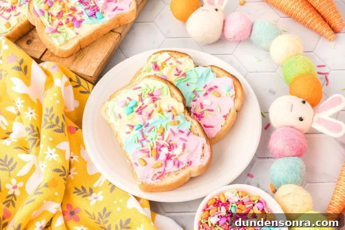 Toast with rainbow cream cheese and rainbow sprinkles on top. 