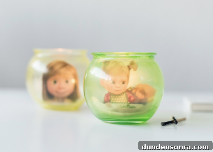 Glass candle holders with photos of Inside Out characters in them. 