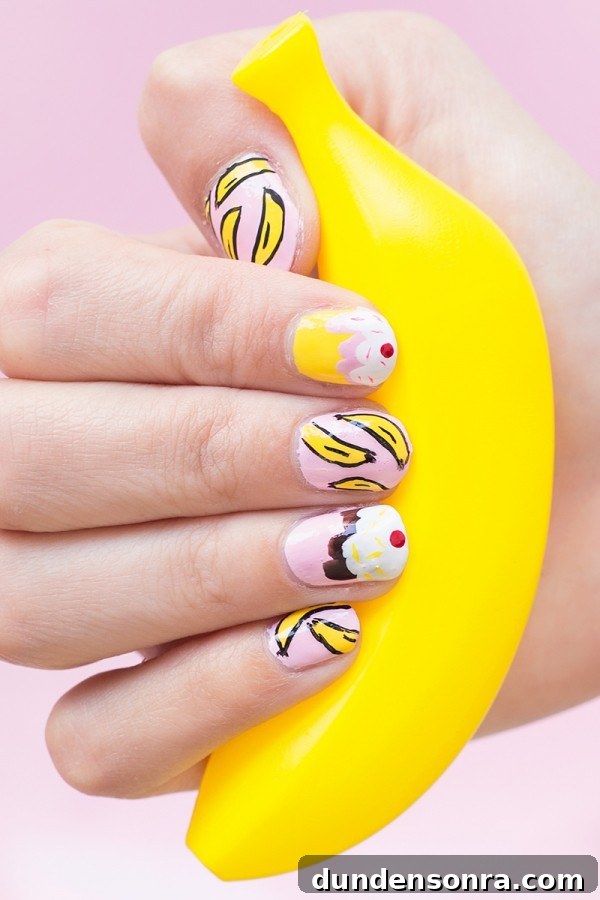Manicure Party Someone holding a fake banana with banana split nails
