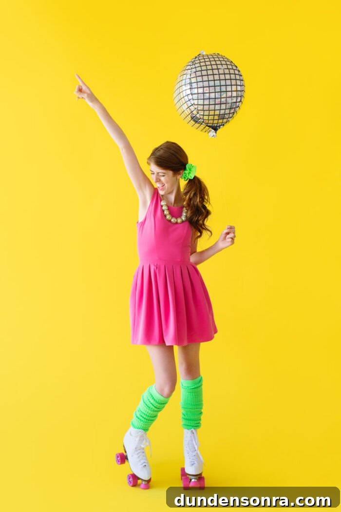 Rollerskating Party Woman standing with a disco balloon and roller skates on.