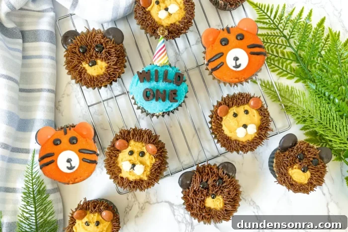 Wild One Birthday Party Overhead shot of animal designed cupcakes.