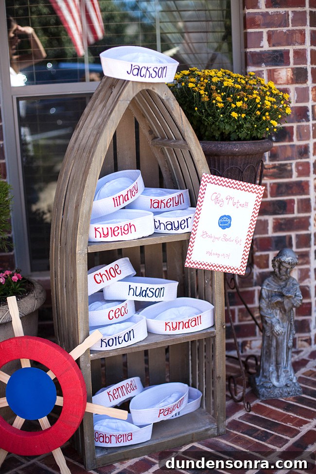 First Mate Birthday Party Boat shaped shelf with customized sailor hats in it.