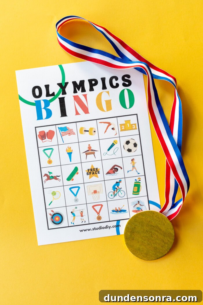 Olympics bingo pdf on a yellow background next to a gold medal. 